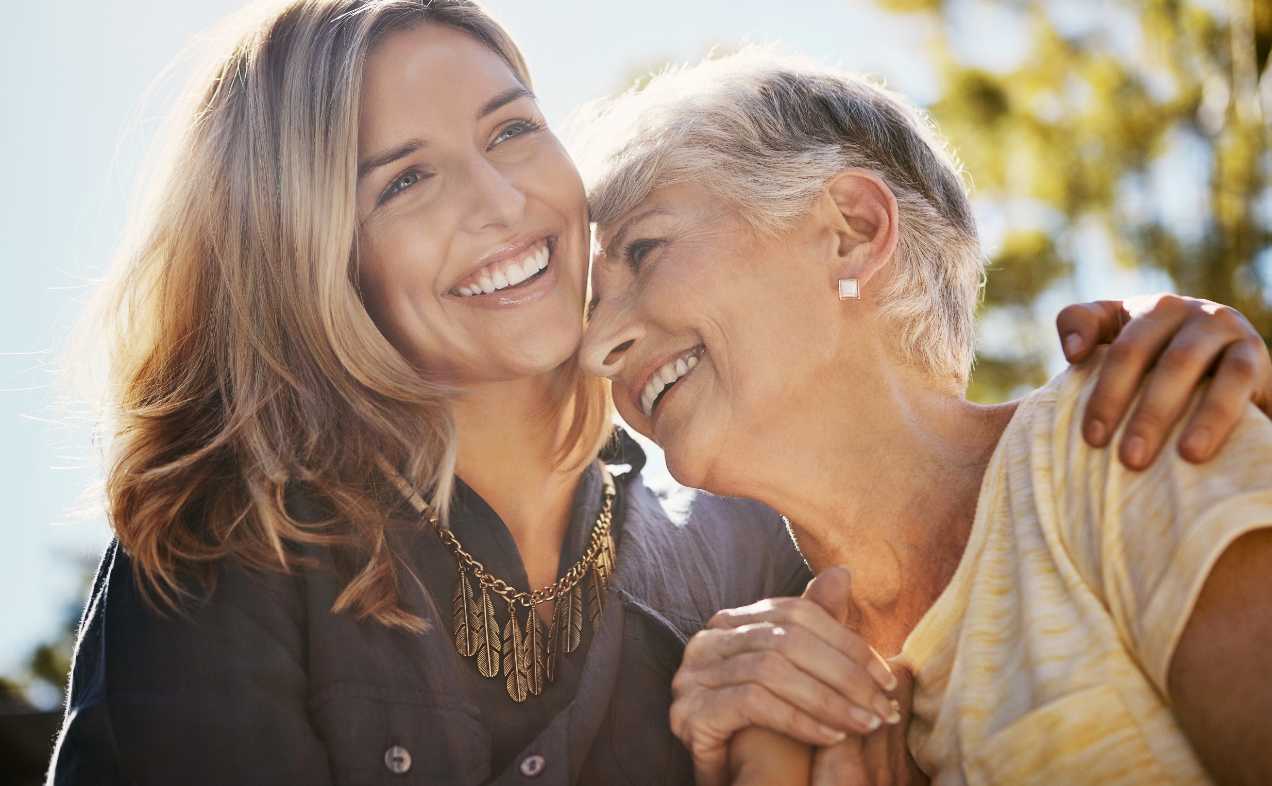 A mother and daughter smiling after learning about what Medicare is.